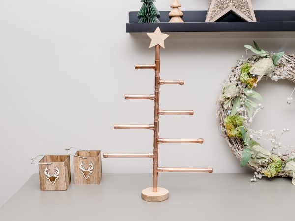 Copper Christmas Tree with wooden star decorated with no decorations